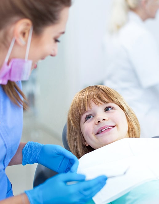 Dentist performing a dental checkup evaluation on a child